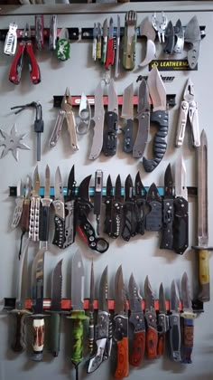 there are many different types of knives hanging on the wall