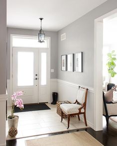 a living room filled with furniture and a white door