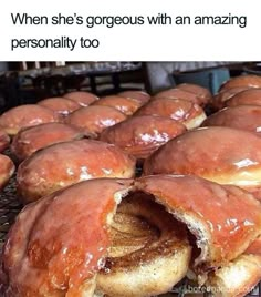 a bunch of doughnuts sitting on top of a rack next to each other