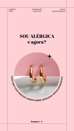 two gold hoop earrings sitting on top of a pink book with the words, soua ale