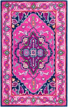 a pink and blue rug with an ornate design on the center, in different colors