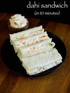 sandwiches are stacked on top of each other on a black plate with the words, dahi sandwich in 10 minutes