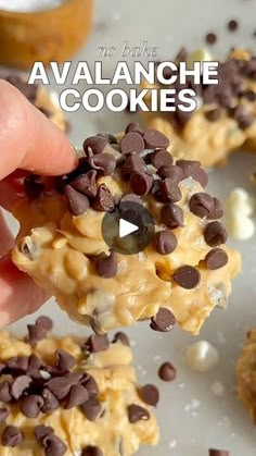 someone is holding up some cookies with chocolate chips on them and the words, no bake avalanche cookies