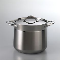 a stainless steel pot with two handles on a white background, it appears to be empty