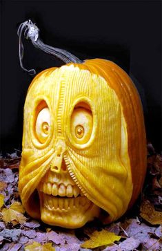 a carved pumpkin with an evil face on it