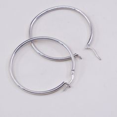 "1.5\" Vintage sterling silver loop earrings, fashion minimalist primitive hoops, Stamped 925" Minimalist White Gold Hoop Earrings With Sterling Silver Clasp, Minimalist White Gold Earrings With Sterling Silver Clasp, Minimalist Small Hoop Metal Earrings, Minimalist Small Metal Hoop Earrings, Minimalist Small Hoop Earrings In Metal, Minimalist Sterling Silver Clasp Earrings, Minimalist Small Hoop Clip-on Earrings, Modern Silver Hoop Earrings With Sterling Clasp, Minimalist Silver Earrings With Sterling Silver Clasp