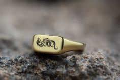 This stunning gold signet ring features a beautifully engraved Chinese dragon, making it a unique and meaningful piece of jewelry. The rectangle-shaped design adds a touch of modern sophistication, perfect for those who appreciate intricate craftsmanship. Made from high-quality gold, this custom dragon ring combines elegance with personal significance. Ideal for both men and women, this personalized signet ring is a versatile accessory that enhances any look. Whether as a personal statement piec Rectangular Red Signet Ring For Gift, Dragon Signet Ring, Yellow Gold Jewelry With Dragon Design For Gift, Luxury Gold Dragon Design Jewelry, Dna Jewelry, Yellow Gold Dragon Pendant Jewelry, Dragon Ring, Gold Dragon, Fancy Gifts