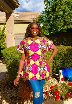 Beautiful African print top for women African fabric 100% cotton. This colorful Ankara summer blouse is versatile, flattering, and available for all sizes including plus sizes. Features: Ankara blouse with split neckline. African shirt for women with side slits, pleats and fun curved hem. Wear this African top over pants, skirts, shorts, or jeans and cinch it with your own belt for a different look- see all photos. This item will be specially handcrafted for you upon purchase. We appreciate including your bust, waist, and hip measurements at checkout otherwise, we will use the measurements listed with the size you selected. Model - 5'7" MEASUREMENT GUIDE: We are happy to answer any questions regarding measurements and styles before purchase. Note - the customer is responsible for including Pink Cotton Smock Blouse, Pink Cotton Smock Top, Pink Smock Cotton Top, Fitted Pink Smock Top, Fitted Multicolor Tunic Top, Relaxed Fit Short Sleeve Smocked Blouse, Relaxed Fit Short Sleeve Smock Blouse, Relaxed Fit Smock Top With Short Sleeves, Casual Multicolor Smock Tops