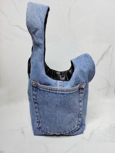 an old pair of jeans has been turned into a purse