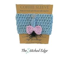 the stitched edge coffee sleeve is blue and pink with a bow at the top