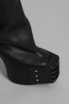 65% leather 34% cotton 1% elastane Chic Leather Heeled Boots With Metal Feet, Modern Fitted Platform Boots, Modern Fitted Black Boots, Chic Leather Boots With Metal Feet, Fitted Black Boots With Metal Feet, Fitted Leather Platform Boots, Edgy Leather Heeled Boots With Metal Feet, Edgy Leather Boots With Square Toe, Edgy Leather Heeled Boots For Work