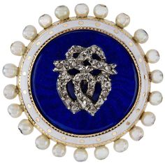 A Victorian enamel, pearl and diamond brooch, the central silver entwined double heart and ribbon bow motif encrusted with rose-cut diamonds, to a cobalt blue guilloché enamel round shaped panel with white enamel and pearl border, all set to a yellow gold mount, with glass locket back, circa 1880, measuring approximately 3cm in diameter, gross weight 12.6 grams. This antique brooch is in very good condition, insignificant enamel defiant. Unmarked tested as 18ct Gold and Silver. A charming late-V Pearl Border, Victorian Brooch, Heart Shaped Frame, Victorian Pendants, Glass Locket, Bee Brooch, Antique Brooches, Diamond Brooch, Silver Tops