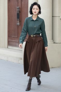 The attention to detail in the construction of this long brown wool skirt is evident in every stitch, show casing the craftsmanship and expertise that went into its creation. With its timeless silhouette and luxurious feel. DETAIL * 50% wool, 50% fiber,nylon, etc. * Fully satiny lining, more nice to the touch body * Two side seam pockets * Elastic waist at back * Long wool skirt * Swing skirt * High waist skirt * Party skirt * For autumn and winter * Belt not for sale * Dry clean only * Lean More about the items From the FAQs on the page bottom MODEL SIZE Bust 85 cm(33.4") Waist 67 cm(26.7") Height 168cm (5' 6") She wears size XS Choose CUSTOM Order if you * Need a better fit * Can't find your size in our size Chart * Change the Style * Chang the Length * Your Height is not Between 5'1" - Brown Maxi Skirt With Pockets For Fall, Brown Maxi Skirt For Workwear And Fall Season, Brown Maxi Skirt For Workwear In Fall, Elegant Brown Skirt With Pockets, Brown Office Skirt With Pockets, Brown Wool Lined Skirt, Brown Full Skirt For Workwear, Brown Full Skirt For Work, Brown Lined Maxi Skirt For Work