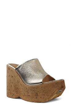 A cork-textured wedge heel adds textural edge to an old-school sandal topped with a smooth leather strap. 5" heel; 2" platform Leather upper and lining/synthetic sole Imported Summer Cork Wedge Heels, Summer Platform Heels With Cork Material, Summer Cork Platform Heels, Cork Wedge Heels With Platform, Cork Platform Open Toe Heels, Cork Platform Heels With Open Toe, Open Toe Cork Wedge Sandals With Platform, Platform Cork Wedge Heels, Cork Platform Wedge Heels