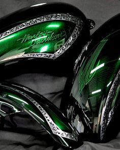 two green motorcycle mirrors sitting on top of a black cloth covered bedding with the words world's most expensive written on them