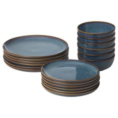 blue and gold dinner plates stacked on top of each other