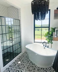 a white bath tub sitting next to a window