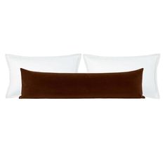 two brown and white pillows sitting next to each other