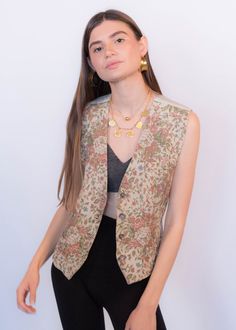 "Vintage 90s Liz Claiborne floral carpet vest. This classic 90s vest comes in the prettiest dusty pink floral print. V-neckline. Sleeveless. Back adjustable belt buckle. Front button fastening. Fully lined. We kindly ask that you please view all measurements for comparison so you can get your desired fit. * Brand: Liz Claiborne * Decade: 1990s * Fabric: 57% Rayon, 43% Cotton * Lining: 100% Rayon back & lining * Color: Light Beige with Dusty Pink Floral Print C O N D I T I O N * Excellent vin Retro V-neck Vest For Spring, Vintage V-neck Vest For Spring, Fitted Vintage V-neck Vest, Spring Floral Print V-neck Vest, Retro V-neck Spring Vest, Spring V-neck Retro Vest, Retro Spring Vest, Spring Vintage Vest, Vintage Fitted Vest For Spring