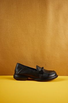 Introducing our Rumour Has It Simple Your Way Leather Loafer! Comfort and style come together in these classic black loafers. Made from high-quality leather, these loafers are perfect for any occasion. Step out in confidence and take on the day with ease. Simplify your style with our Simple Your Way Leather Loafers. 0.98" heel Pull-on Leather upper Leather lining Leather footbed Rubber sole Black Slip-ons With Brogue Detailing For Work, Black Leather Almond Toe Loafers, Black Slip-ons With Rubber Sole For Work, Black Leather Loafers For Business Casual, Black Moccasins With Textured Sole For Work, Black Moccasins With Removable Insole For Business Casual, Black Moccasins With Stitched Sole For Business Casual, Black Moc Toe Leather Shoes For Work, Black Flats With Stitched Sole For Fall