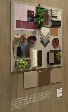 a display with many different types of materials on it's walls and plants in pots