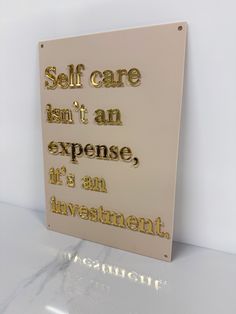 a sign that says self care isn't an expensive it's an investment