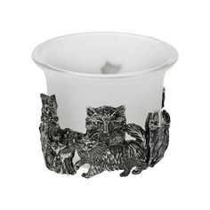 a glass cup with three cats on the inside and one cat in the middle, sitting next to each other