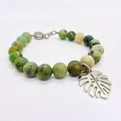 "Growth" In Feng Shui, the Monstera brings luck and growth. Plus, let's be honest, it's a plant moms favorite. It's okay, we won't tell the other plants! This bracelet is made of natural Australian jade stone beads and a silver plated Monstera leaf charm. The closure is magnetic. Please be sure to measure your wrist correctly BEFORE buying! I want you to be 100% happy with your purchase and being sure you are selecting the proper size bracelet before finalizing your purchase plays a big part in Green Beaded Bracelets For Gifts, Nature-inspired, Nature-inspired Green Beaded Bracelets For Gift, Green Nature-inspired Beaded Bracelets For Gift, Green Nature-inspired Beaded Bracelets As Gift, Green Round Beads Bracelet, Nature-inspired, Nickel-free Green Beaded Bracelets As A Gift, Nickel-free Green Beaded Bracelets For Gift, Nickel-free Green Beaded Bracelet For Gift, Green Nickel-free Beaded Bracelets As A Gift