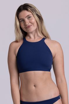 The Kaylee is a high neck, full coverage bikini top with thick straps in the back for the best support. This swimsuit top can double as a sports bra - rock the Kaylee at a hot yoga class or at swim practice - whatever suits your style! Features: Good for: Swim, Water Polo, Surfing, paddling, ocean activities, pool activities, lifestyle Fixed-Back Thick Strapped Swim Top + Sports Bra Full Coverage High Impact Unpadded Tagless Lined for maximum privacy Chlorine proof 2-way stretch Reinforced stitc Seamless T-back Halter Top For Yoga, Sporty T-back Halter Top For Sports, Athleisure T-back Swimwear, Bra Friendly, Seamless Halter Neck Sports Bra For Yoga, Racerback Halter Top For Yoga, Bra-friendly Halter Top For Gym, Sporty Seamless Halter Top For Yoga, Gym-ready Bra Friendly Halter Top, Gym-friendly Bra Halter Top