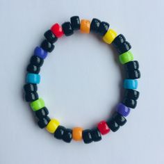 Black & rainbow beaded bracelet Black Beaded Rave Bracelets, Trendy Multicolor Beaded Bracelets With Black Beads, Black Rave Bracelets As Gift, Trendy Black Bracelets With Colorful Beads, Black Friendship Bracelets With Colorful Beads As Gift, Trendy Black Friendship Bracelets With Round Beads, Handmade Black Beaded Bracelets For Rave, Multicolor Casual Bracelet With Black Beads, Multicolor Beaded Casual Bracelets