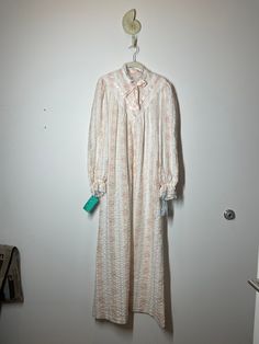 "Estate sale find. Sweet vintage New with Tags Miss Elaine pink floral striped seersucker house dress duster.  Tag is Small and I would say that its true to size and can fit a modern day Small - Medium.   Please review pics, video, and measurements below.  All sales final. 20\" PTP 55\" STH *This is a vintage item which has history and was pre-loved. All major flaws are listed. **I do not accept returns unless the item was misrepresented. Please message me first and ask questions! I want to make Long Sleeve Pink Nightgown For Spring, Vintage Pink Long Sleeve Sleepwear, Vintage Pink Sleepwear For Spring, Vintage Long Sleeve Nightgown For Pajama Party, Vintage Spring Sleepwear, Vintage Spring Sleepwear For Home, Spring Retro Nightgown For Sleep, Retro Pink Sleepwear For Spring, Retro Sleepwear For Spring Pajama Party