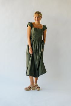 This playful, quirky dress exudes confidence with its ruffle sleeves and flattering midi length. Perfect for adding some fun to your everyday wardrobe, its olive color adds a touch of personality to any outfit. Get ready to turn heads and feel fabulous in the Whitmire Ruffle Sleeve Midi Dress! self/lining: 100% cotton Fabric Care Guide Here Sizing & Fit Measurements are approximate and taken while laying flat across the front. Not doubled. x-small: bust = 14.5"; waist = 13"; length = 48" small: Quirky Dress, Half Zip Sweaters, Sleeve Midi Dress, Olive Color, Midi Dress With Sleeves, Ruffle Sleeves, Denim Jumpsuit, Wide Leg Denim, Zip Sweater