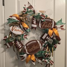 a football wreath is hanging on the front door