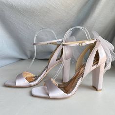 Badgley Mischka Kim Mesh Bow Ankle Strap Block Heel Color: Soft Lavender Purple Women's Size 9 New In Partial Box - Missing Lid "For The Blushing Bride With A Fierce Nature. Stride Towards Your Happily Ever After In Shoes That Empower You With Height And Highlight Your Femininity. Kim Elevates You With Confidence, And A 3 ½ Inch Block Heel. The Tulle Bow At The Back Is Reminiscent Of A Bridal Veil, Bringing Blissful Beauty To Your Look." Specifications Mp6231 Heel Height: 3.54” (90mm) Block Heel Elegant Lavender Heels For Party, Elegant Lavender Ankle Strap Heels, Elegant Lavender Heels For Formal Occasions, Bejeweled Shoes, Black Evening Shoes, White Heels Wedding, Silver Strappy Sandals, Coquette Kawaii, White Block Heels