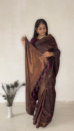 Timeless silk and design saree, Embrace the richness of the Windsor wine saree, beautifully adorned with floral wines and intricate weaves patterned borders. It takes longer on the handloom as it has a human involvement to have a fine designs, which make fabric rich and luxurious. Color: Wine Fabric: Pure Brocade silk Design Type: Kanjivaram silk saree Items Included: Saree | Unstitched blouse Wash Care: Dry Clean Only Disclaimer Text: Product color may slightly vary due to photographic lighting Luxury Brocade Fabric For Saree, Saree Diwali, Wine Saree, Zari Work Saree, Silk Design, Design Saree, Diwali Special, Engagement Ceremony, Party Kleidung