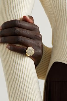 Retrouvaí's ring is part of the brand's 'Talisman' collection - each style is engraved with a unique symbolic sentiment. Handmade from 14-karat gold, this version features the phrase 'What Goes Around Comes Back Around', which represents karma. Luxury Etched Ring Jewelry, Luxury 14k Gold Etched Jewelry, Luxury 14k Gold Etched Rings, Luxury Etched 14k Gold Rings, Luxury Engraved Brass Rings, Luxury Etched Jewelry, Luxury Tarnish-resistant Brass Rings, Luxury Etched Yellow Gold Jewelry, Luxury Yellow Gold Engraved Sterling Silver Ring