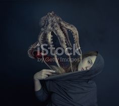 a woman with an octopus head covering her face