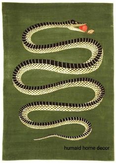 a green rug with a snake on it