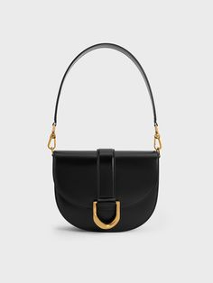 The Gabine saddle bag is back and better than ever. This iconic piece returns by popular demand, now featuring a luxurious real leather finish that offers a buttery-smooth texture. The design remains unchanged, from the U-shaped buckle to the classic saddle silhouette, along with the single handle, which can be swapped for a longer shoulder strap for hands-free convenience and versatile styling options. Gabine Saddle Bag, Leather Saddle Bags, Leather Finish, Charles Keith, Saddle Bag, Smooth Texture, Hands Free, Saddle Bags, Real Leather