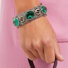 Bracelet is crafted in Italy with the namesake motif interspersed with flowers - an archival tradition of the house - punctuated with faceted green crystals, and secures with a tiger - head bayonet fastening, for a sense of old-world elegance.Sterling silverMaximum width of band 1.1in/2.9cm Maximum width of opening 2.4in/6cm Inner width when closed 2.4in/6cmMade in Italy Luxury Silver Emerald Jewelry, Luxury Jeweled Crystal Jewelry, Luxury Crystal Jeweled Jewelry, Luxury Green Oval Bracelet, Designer Green Jewelry For Formal Occasions, Luxury Jeweled Crystal Bracelets, Designer Jubilee Bracelet Jewelry In Metal, Designer Metal Jubilee Bracelet, Luxury Jewelry For May Birthstone