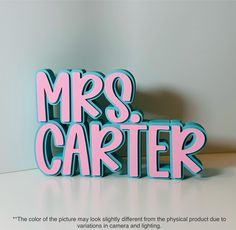 the word mrs cartter is made out of plastic letters and stands on a table