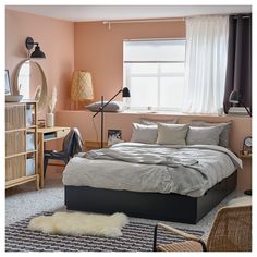 a bedroom with pink walls and white curtains