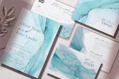 the wedding stationery is designed with blue and white marble