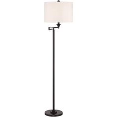 a black floor lamp with a white shade