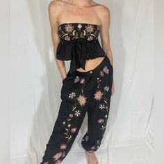 Extra Small Free People Black Flower Embroidered Matching Set - Strapless Crop Top And Comfortable Loose Fit Pants, Never Worn Spring Black Embroidered Pants, Spring Embroidered Black Pants, Bohemian Floral Embroidery Pants For Summer, Black Festival Pants For Spring, Spring Bohemian Embroidered Pants, Black Pants For Spring Festival, Black Floral Embroidered Bottoms For Summer, Black Bottoms With Floral Embroidery For Summer, Floral Embroidered Bottoms For Spring Festival