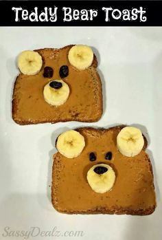 two pieces of toast with peanut butter and banana slices on them, each topped with a bear face