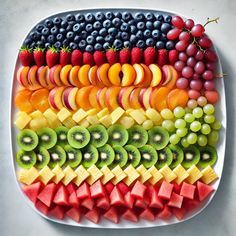 a platter filled with sliced up fruit