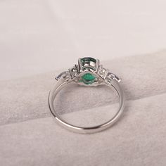 * The delicate ring displays Emerald as main stone. The cluster side stones make the ring similar to the blooming flower . For who wearing this special & delicate ring, will shine like a goddess. ◆ Production Description: Main stone Type: Emerald Main Stone Shape: Oval Cut Main Stone Size: 6*8mm (1.13ct) Side stone: CZ & lab Alexandrite Metal: 925 Sterling silver - Other options available in the drop down menu ◆ Customization: √Free for Add Engraving √Other Metal Type Available √Other Ge Elegant Flower Ring As Promise Ring With May Birthstone, Anniversary Oval Flower Ring Fine Jewelry, Oval Diamond Crystal Ring For May Birthstone, Classic Silver Emerald Ring With Accent Stones, Elegant May Birthstone Flower Ring With Gemstone, Exquisite Oval Crystal Promise Ring, Oval Three Stone Emerald Wedding Ring, Oval Three Stone Emerald Ring For Wedding, Oval Flower Ring With Center Stone