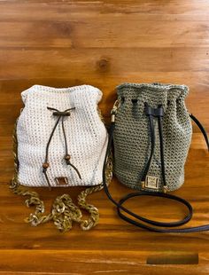 Introducing our handmade crochet bucket bag, thoughtfully crafted for the fashion-forward individual. Made with exceptional attention to detail, this stylish and functional purse is crafted with recycled cotton and polyester blend yarn. The durable shoulder strap ensures comfort and convenience. The green bag has a solid 6 inch base and the beige bag has a 9 x41/2 inch oval base, both are 91/2 inches tall and provide spacious interiors with ample room for all your essentials, while the drawstrin Bucket Bag Crochet, Crochet Bucket Bag, Vintage Inspired Handbags, Shoulder Bag Crochet, Small Bucket Bag, Crochet Bucket, Beige Bag, Crochet Purse, Handmade Purses