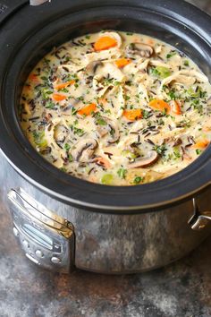 a pot filled with soup sitting on top of a table